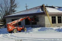 Installing soffit panels at Jackson Business Center